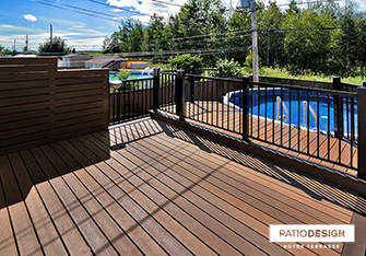 Patio with overground pool by Patio Design inc.